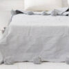 Elevate Your Space with Handwoven Moroccan Pom Pom Throw - A Timeless Blend of Comfort and Bohemian Elegance