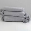 Elevate Your Space with Handwoven Moroccan Pom Pom Throw - A Timeless Blend of Comfort and Bohemian Elegance - Image 6
