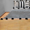 Elevate Your Space with Handwoven Moroccan Pom Pom Throw - A Timeless Blend of Comfort and Bohemian Elegance