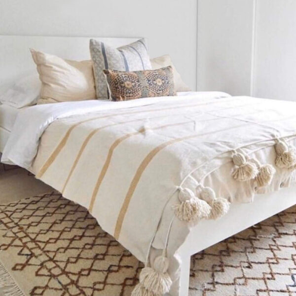 Elevate Your Space with Handwoven Moroccan Pom Pom Throw - A Timeless Blend of Comfort and Bohemian Elegance